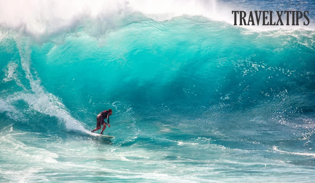 A surfer surfing high wave in Potugal